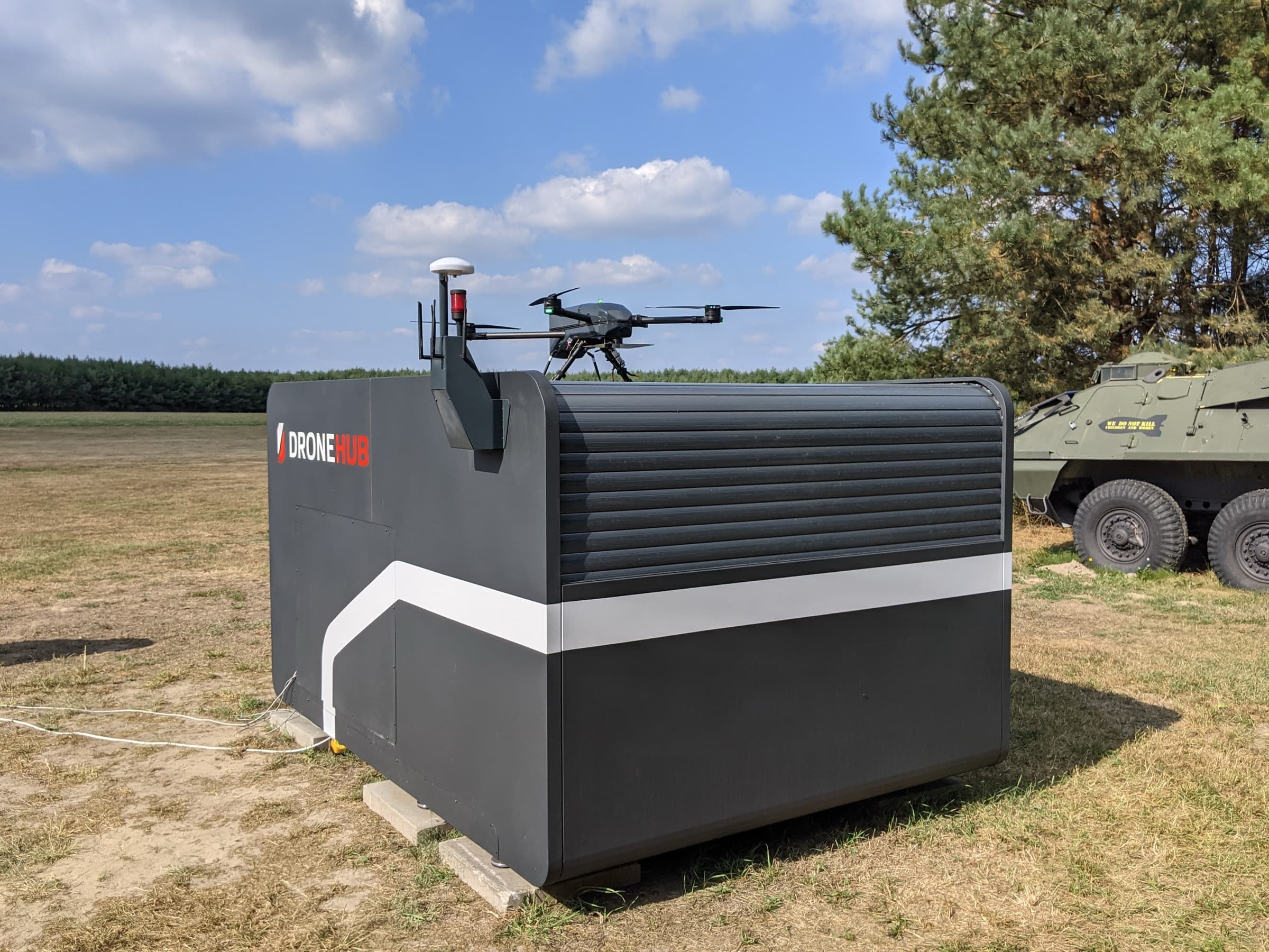 Dronehub stationary monitoring hub in the field with the inspection drone docked inside the autonomous box